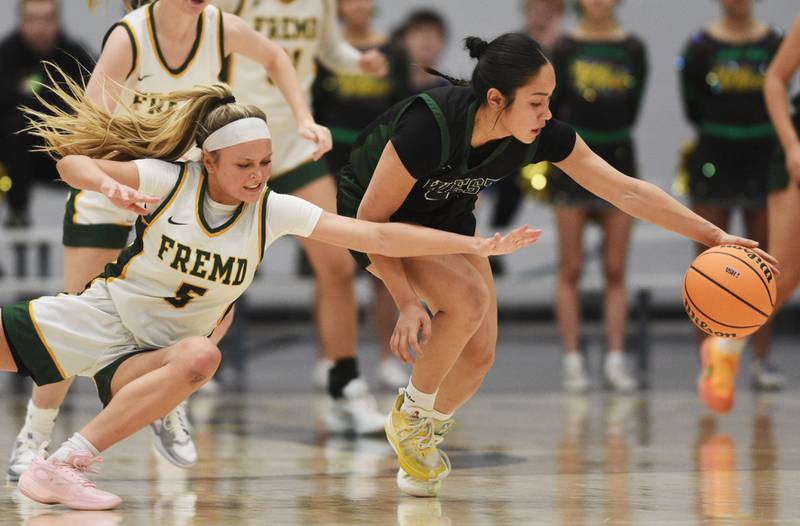 Fremd's Ellie Thompson, left, tries to steal the ball from Glenbard West's Lauren Escalante during the Hersey Class 4A supersectional at Forest View Education Center on Monday, March 3, 2025 in Arlington Heights.
