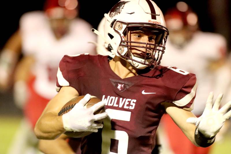 Prairie Ridge’s Luke Vanderwiel runs the ball against Huntley in football Friday night at Crystal Lake.