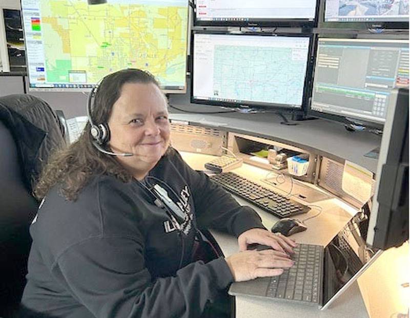 Lead Telecommunicator Julie Dean looks at a tablet with the radar on Tuesday, Feb. 11, 2025 at the Illinois Valley Dispatch Center in Peru.