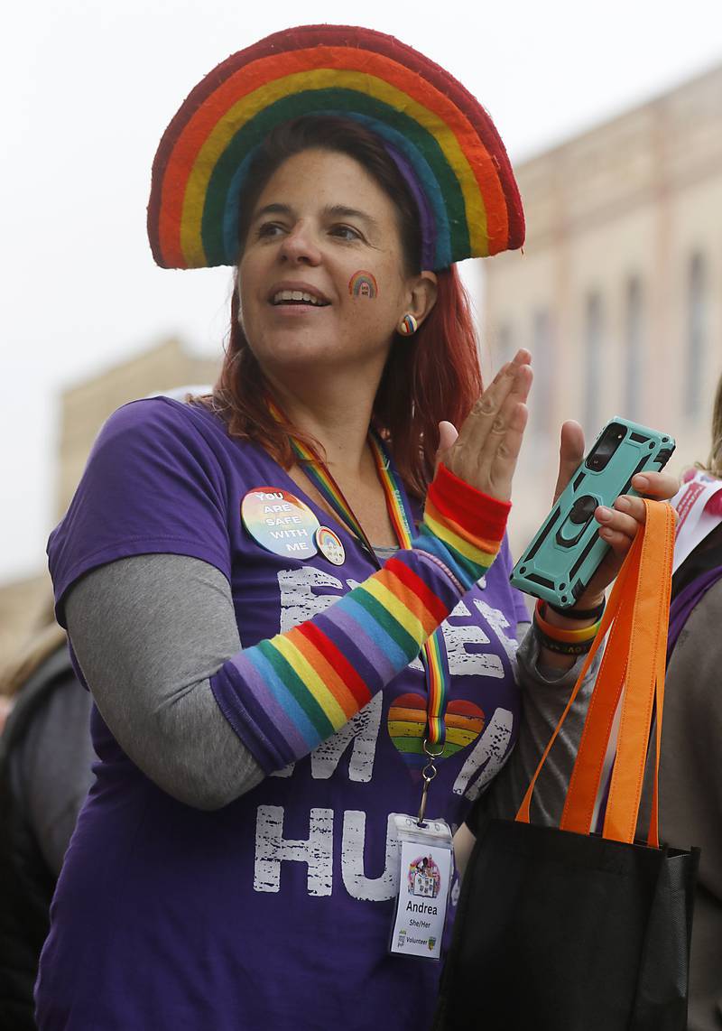 Andrea Hein claps as he parade passes her during the Woodstock PrideFest Parade Sunday, June 11, 2023, around the historic Woodstock Square.