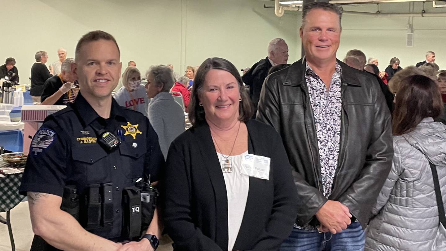 Oswego Village President Troy Parlier (right) with Nancy Patush (center), vice president of OSCC's board of directors and Oswego PD commander Jason Bastin (left) at the Taste of Oswego and OSCC housewarming event April 7 at 3525 Rt 34.
