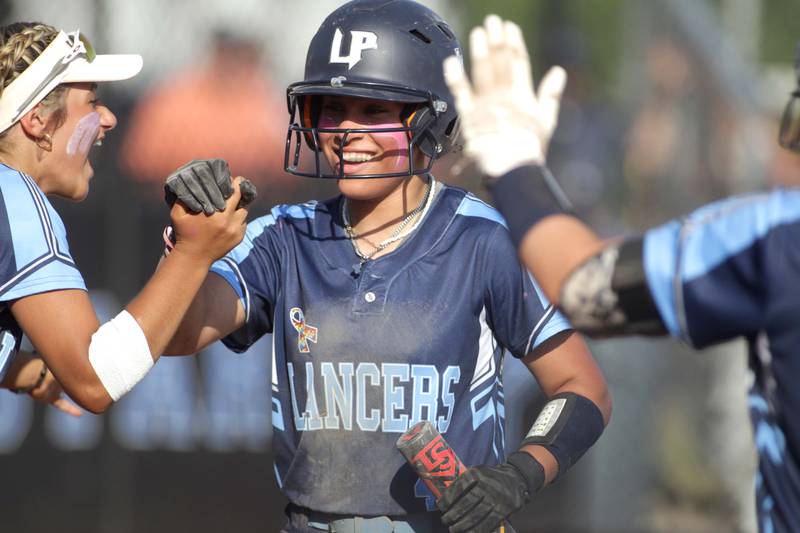 Lake Park’s JD Dowling celebrates a run during the Class 4A St. Charles North Sectional final against St. Charles North on Friday, June 2, 2023.