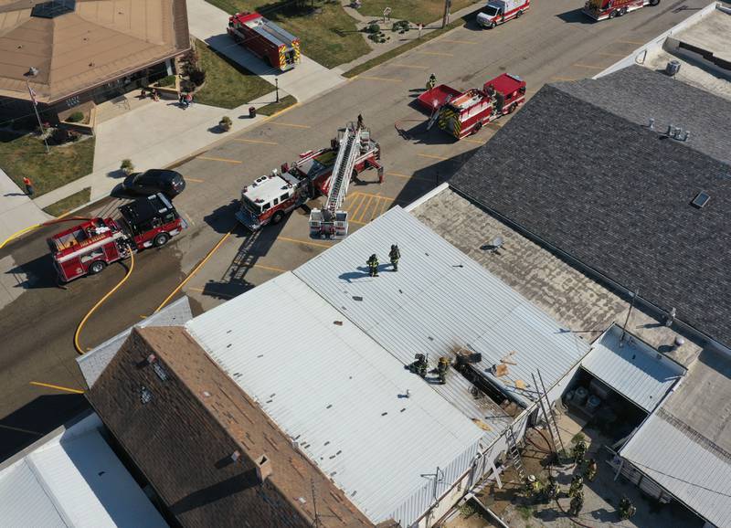 An aerial view of firefighters working the scene of a fire at Grassers Heating and Plumbing on Wednesday, Sept. 17, 2025 in McNabb. The fire began shortly before 10a.m. A Mutual Aid Box Alarm System (MABAS) was elevated to the fourth-alarm. No one was injured in the fire. Fire departments from McNabb, Peru, Utica, Henry, Ladd, Hennepin, Granville, Oglesby, Spring Valley, Leonore, Troy Grove, Seatonville, Wenona, Standard, Lacon-Sparland, Bureau and Tonica all responded to the scene. Firefighters left the scene at 11:30a.m.