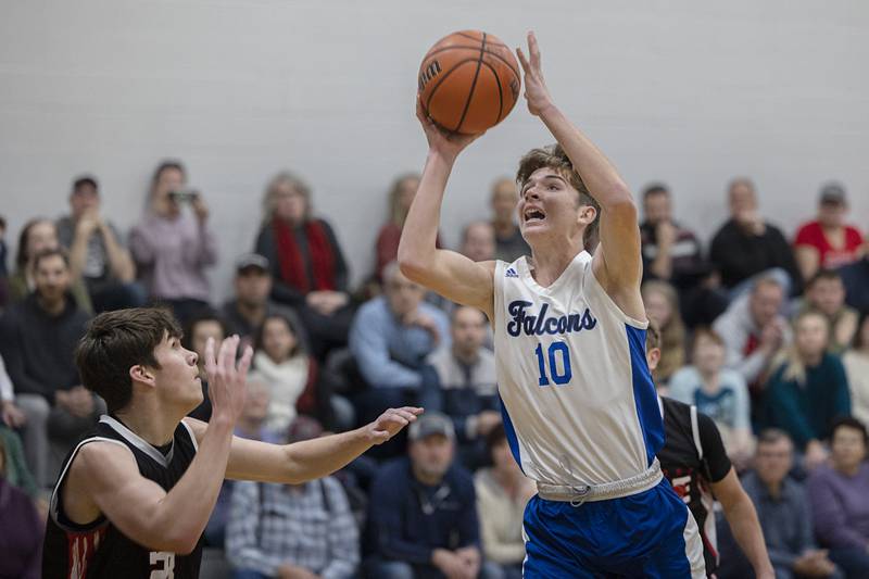 Faith Christian’s Isaiah Schuler puts up a shot Thursday, Dec. 15, 2022 while playing Rockford Fire.