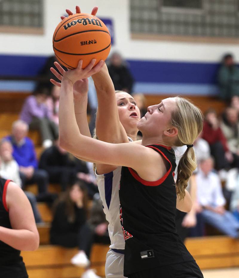 Indian Creek's Gretta Oziah tries to shoot over Hinckley-Big Rock's Anna Herrmann during their game Thursday, Jan. 29, 2026, at Hinckley-Big Rock High School.