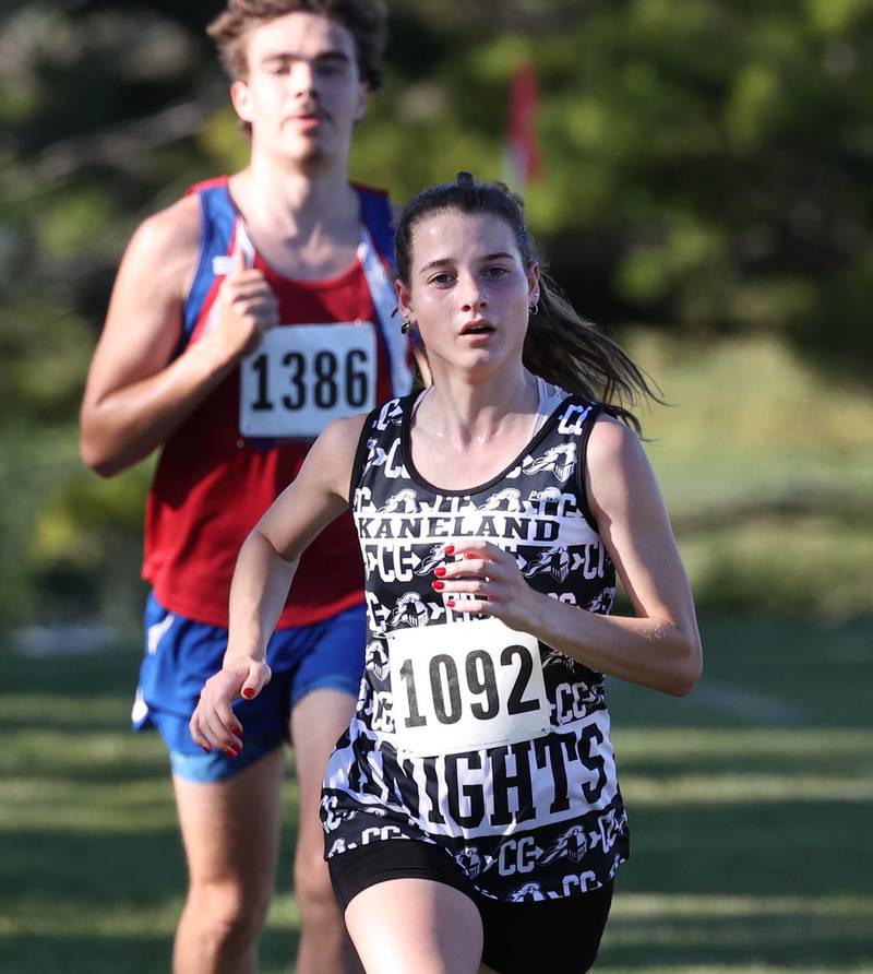 Kaneland’s Danielle Bower finishes the girls varsity race in September 2024 at the Sycamore Cross Country Invite at Kishwaukee College in Malta.