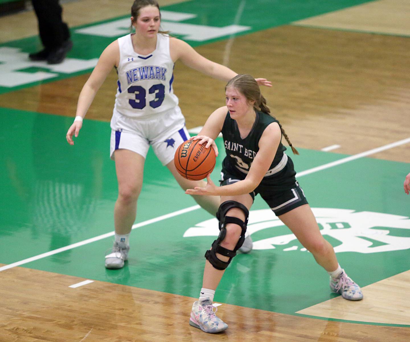 Newark's KJ Friestad (33) defends St. Bede's Ryann Stoudt (34) in the Class 1A Regional title game on Friday Feb. 18, 2022 in Dwight.