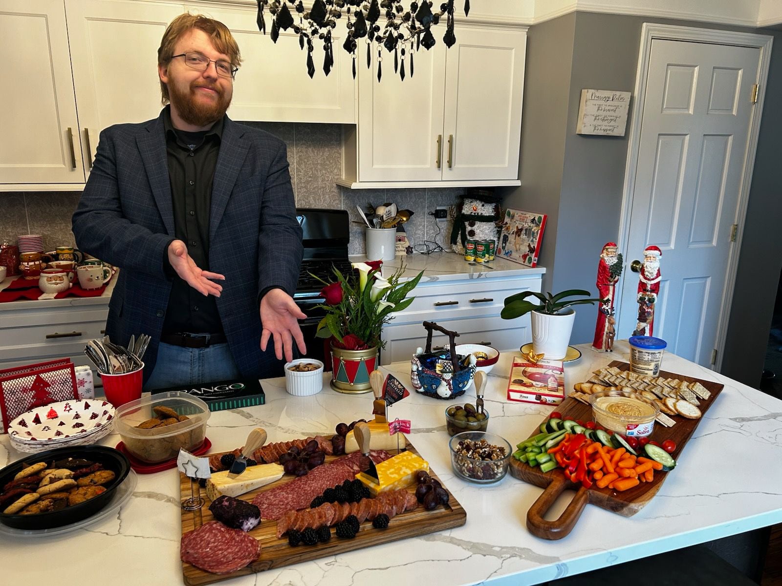 Michael Jake Porter shows off charcuterie boards he made for his family.