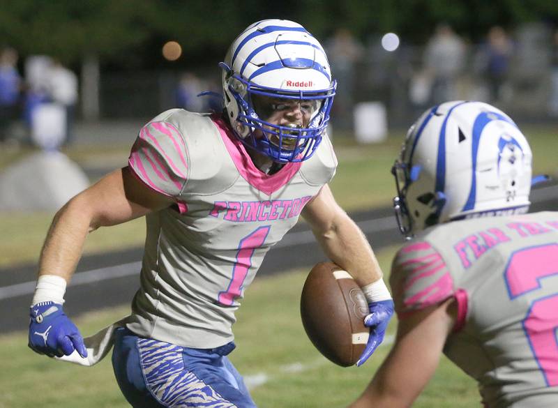 Princeton's Casey Etheridge reacts after scoring a touchdown against Mendota on Friday, Oct. 10, 2025 onBryant Field at Princeton High School.