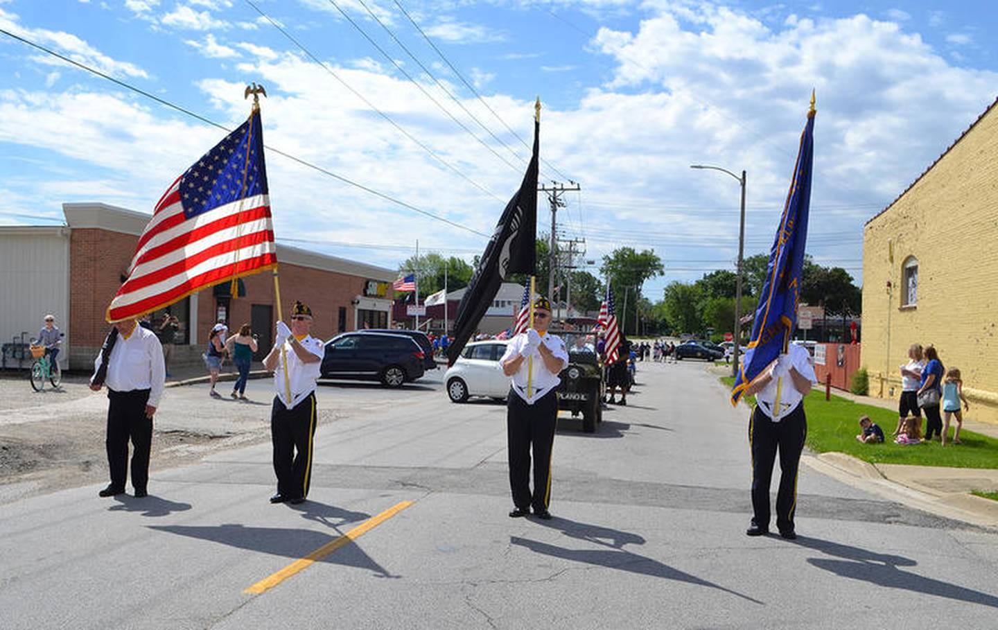 The Plano American Legion Honor Guard displays the flags during the 2017 Memorial Day event in Plano.