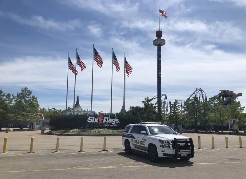 A Gurnee police vehicle sits in front of the main gate at Six Flags Great America in Gurnee, which was open on Monday, Aug. 15, 2022.