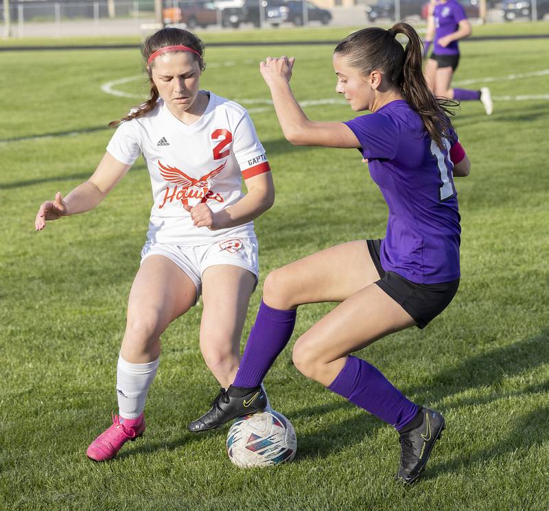 Oregon’s Anna Stender and Dixon’s Leah Stees work against one another Thursday, April 25, 2024 at Dixon High School.