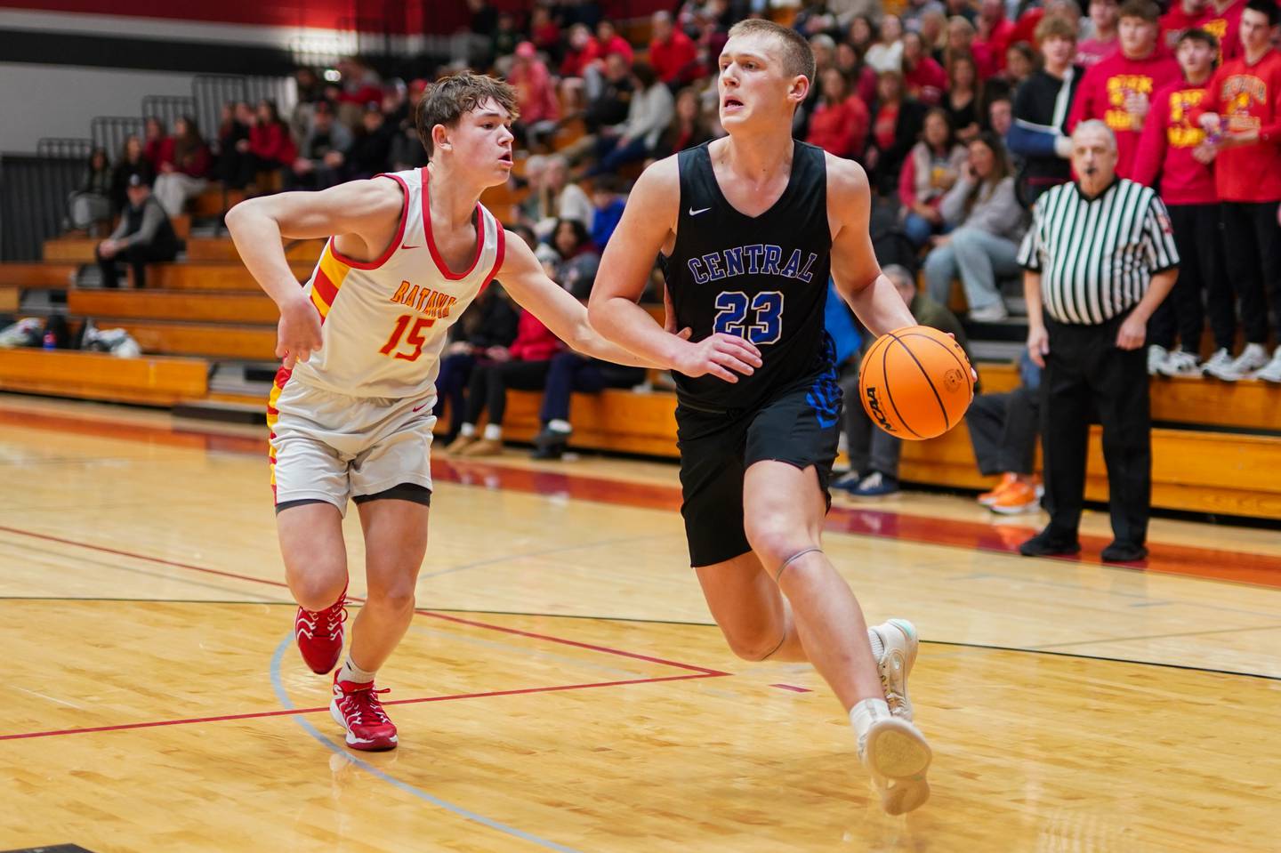 Burlington Central's Jacob Johnson (23) drives to the hoop against Batavia’s Dane Farrar (15) during a Batavia Night of Hoops Basketball game at Batavia High School on Saturday, Jan. 25, 2025.