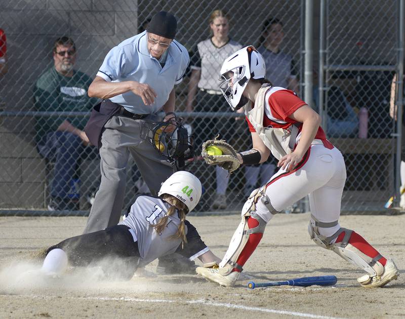 Streator catcher Morgan Kostal tags out Woodland’s Emma Palaschak in the 4th inning Thursday at Woodland.
