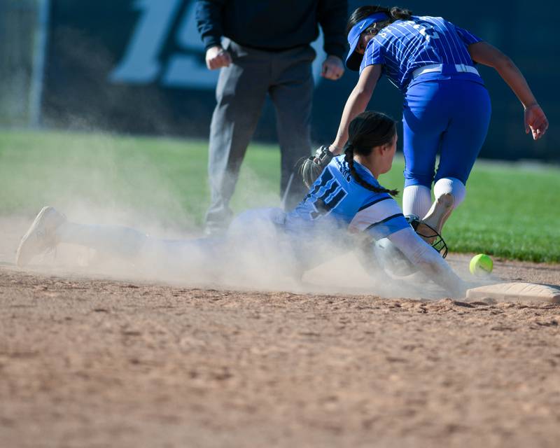 Lake Park's Ava Arenz (74) was safe at second base after St. Charles North's Maddie Hernandez (2) drops the ball during the game on Wednesday April 24, 2024, held at Lake Park High School.