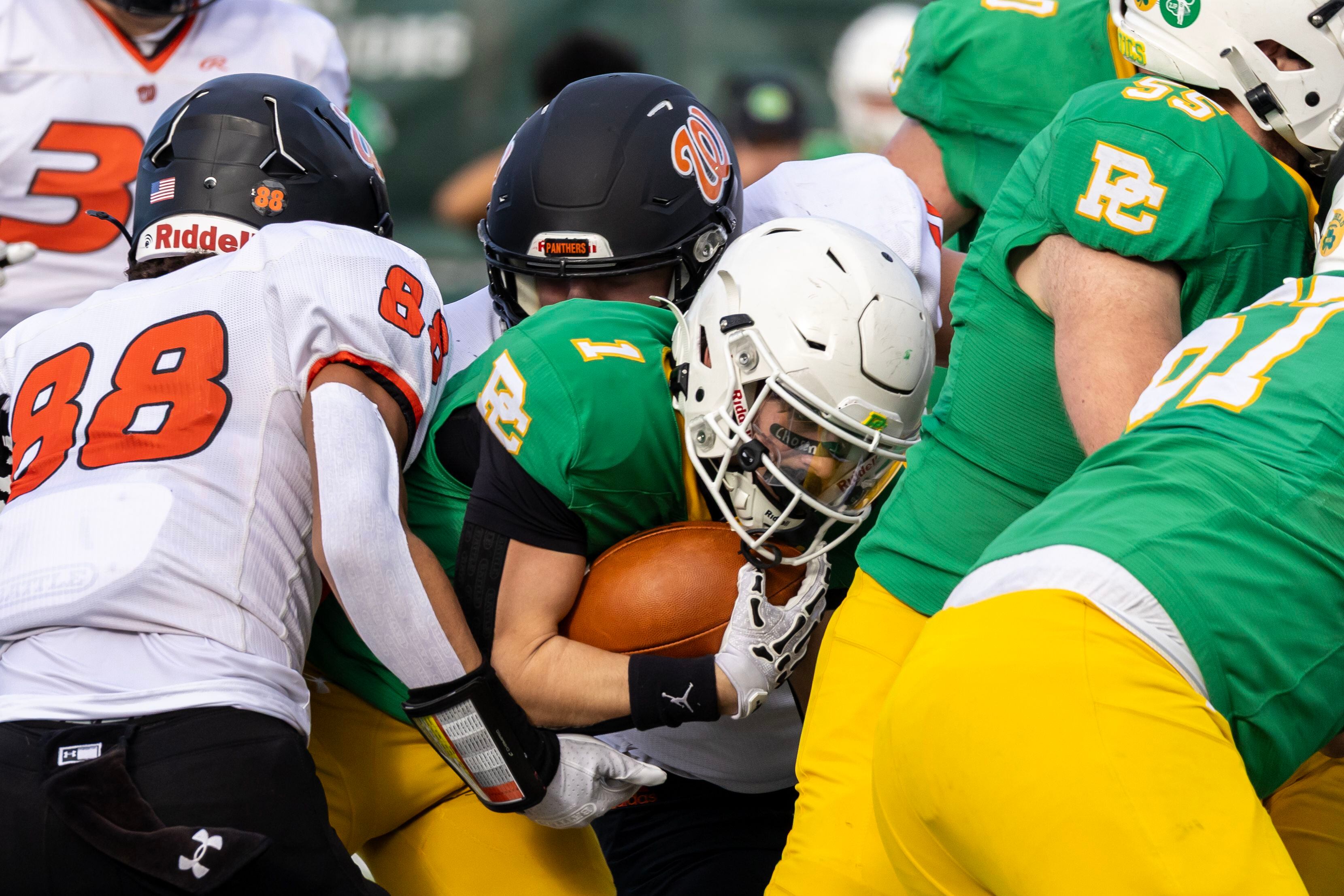 Providence's Bryaden McKay tries to find and opening during a 5A varsity football playoff game against Washington at Providence on Nov. 15, 2025.