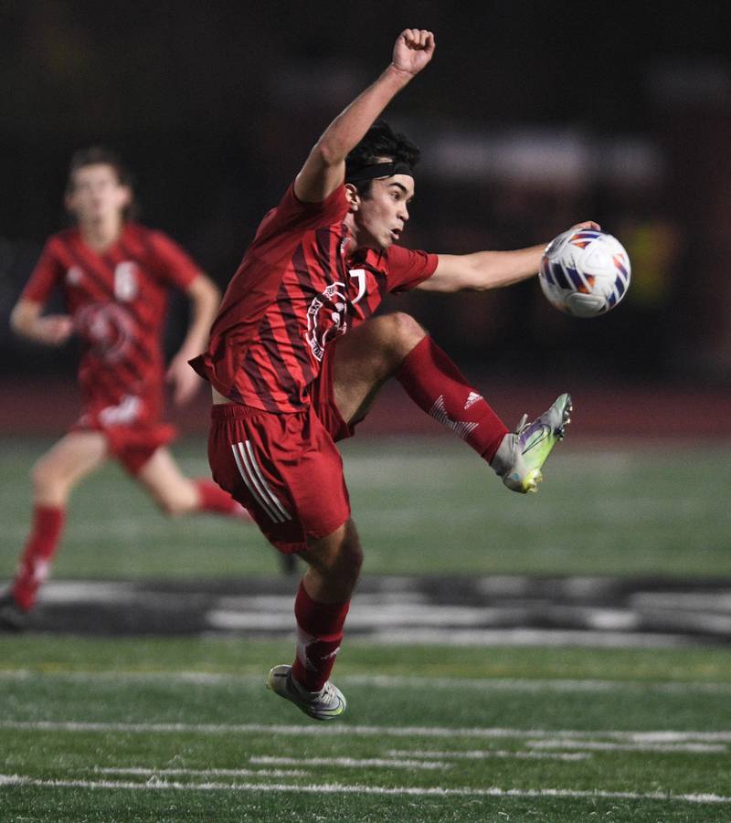 Naperville Central’s Joey Loduca chases the ball again st Hinsdale Central in the Class 3A East Aurora supersectional boys soccer game on Tuesday, November 1, 2022.