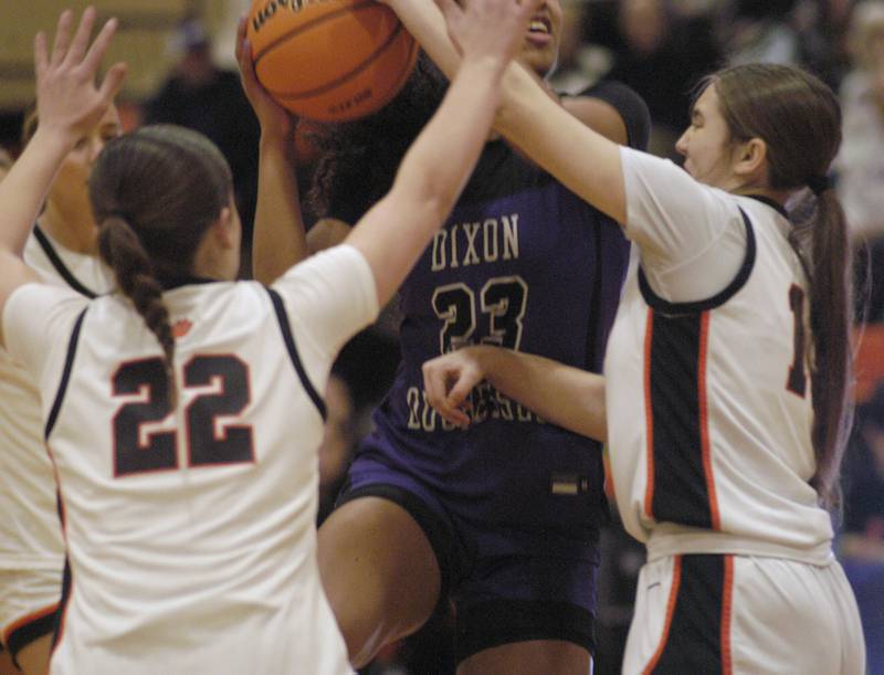 Dixon's Ahmyrie McGowan  takes the ball to the basket surrounded by Byron defenders. The Byron Tigers won over the Dixon Duchesses 46-43 in overtime. The girls basketball game took place at Byron on Saturday, January 24th, 2026