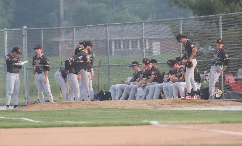 Members of the Illinois Valley Pistol Shrimp warm up before the game against the Alton River Dragons on Thursday, June 5, 2025 at Schweickert Stadium in Peru.