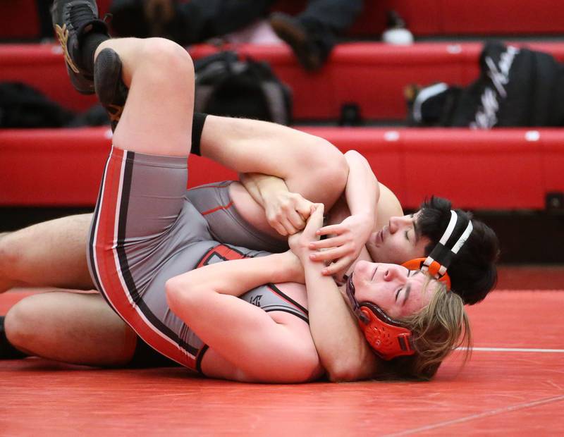 Ottawa's Owen Kearfott wrestles Sandwich's Jakob Gruca on Thursday, Jan. 12, 2023 in Kingman Gymnasium at Ottawa High School.