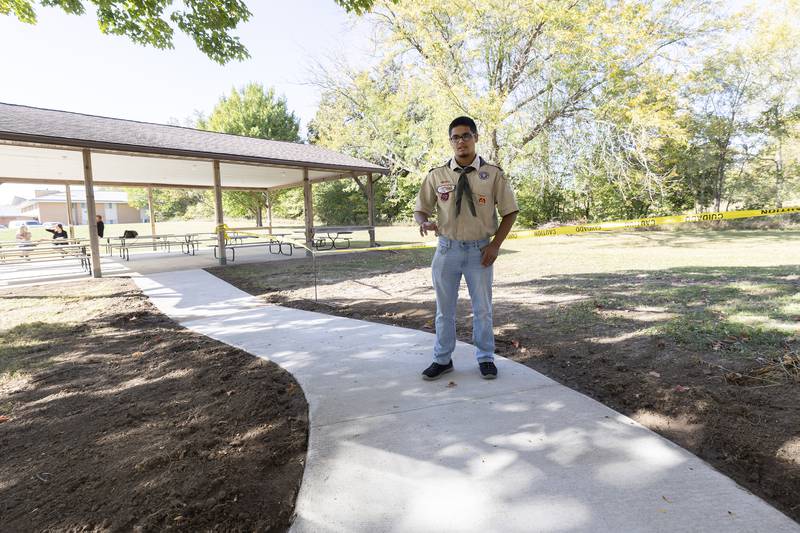 Cruz Ocampo talks about his Eagle Scout project Tuesday, October 8, 2024, outside of Dixon Church of the Brethren. Ocampo and other scouts poured concrete to make a pathway for parishioners.