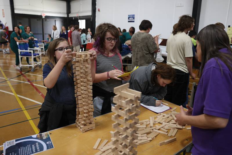 Students practice their building skills at the Joliet Junior College Introduction to Architecture table at the Grundy Area Vocational Center 8th grade Career Fair at Morris High School on Tuesday, Oct. 29, 2024 in Morris