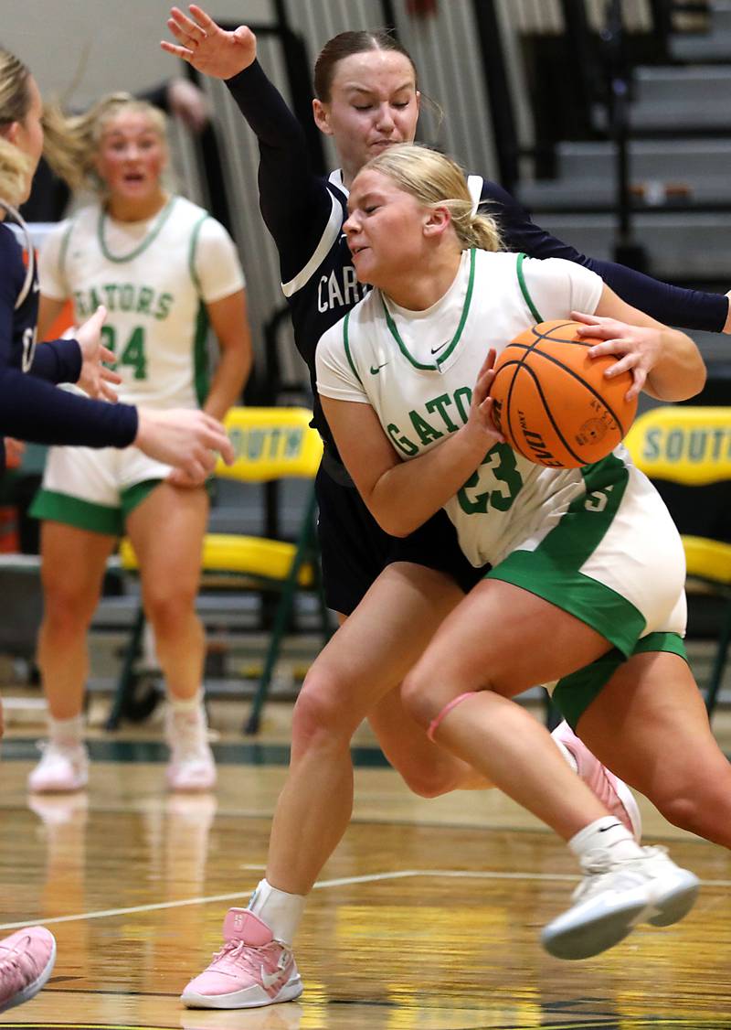 Crystal Lake South's Laken LePage drives the to the basket against Cary-Grove's Ava Santucci during a Fox Valley Conference girls basketball game on Friday, Jan. 23, 2026, at Crystal Lake South High School.