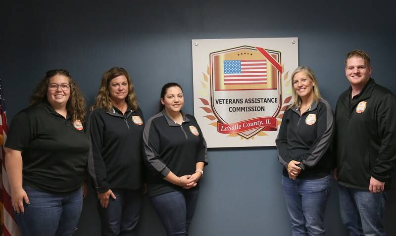 (From left) Emily Hackler, veteran service officer; Kelli Reitgraf, administrative assistant; Christa Hammers, superintendent; Lissa Olson, assistant superintendent; and James Sturtevant, veteran service officer, pose for a photo at the Veterans Assistance Commission office Friday, Oct, 27, 2023, in Peru.