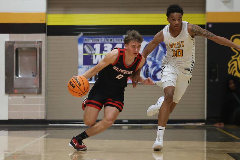 Bolingbrook’s Trey Brost works the ball upcourt against Joliet West on Friday, Jan 24, 2025 in Joliet.