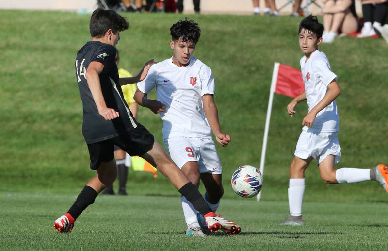 La Salle-Peru's Emir Morales (right) tries to get the ball by Sycamore's Javier Lopez during their game Wednesday, Sept. 7, 2022, at Sycamore High School.