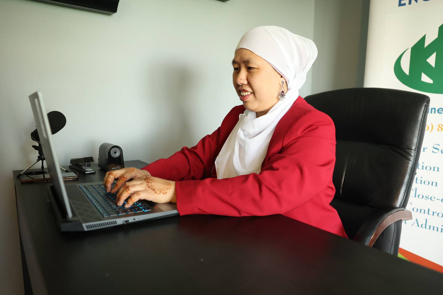 Lien Dastgir, owner of KAD Engineering, works on her laptop on Tuesday, April 25, 2023