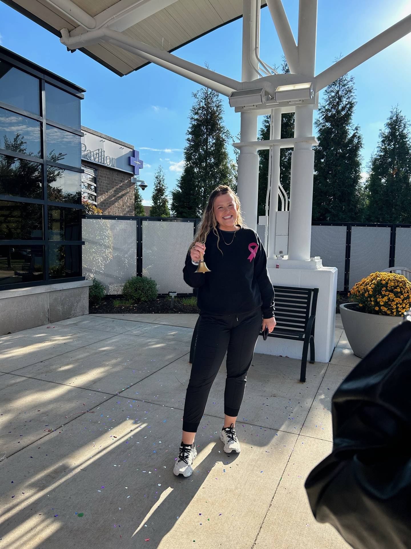 Taylor Keegan rings a bell signifying she completed chemotherapy on Tuesday, Oct. 14, 2025. She will ring the bell again on Sunday, Oct. 19, 2025, during the Real Bears Fans Wear Pink event at Soldier Field.