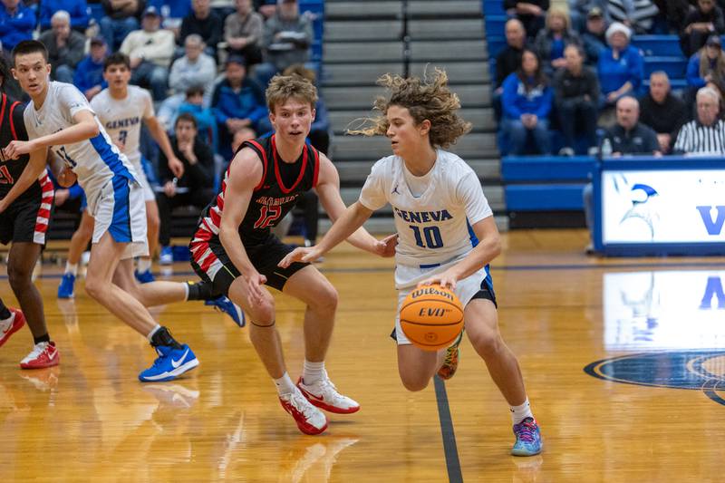 Geneva's Cody Rader brings the ball up court against Batavia on Friday, Dec.19,2025 in Geneva.