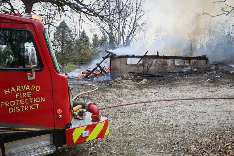 Harvard firefighters put out a fire that Wednesday, Nov. 24, 2021, burned an empty barn.