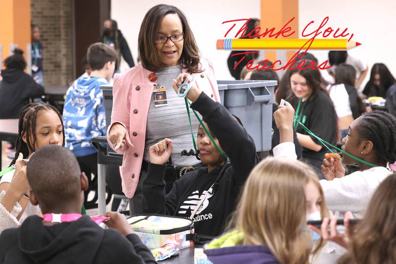 Treveda Redmond, principal at Huntley Middle School, makes sure that sixth-grade students are all wearing their ID’s Tuesday, March 14, 2023, at the school in DeKalb.