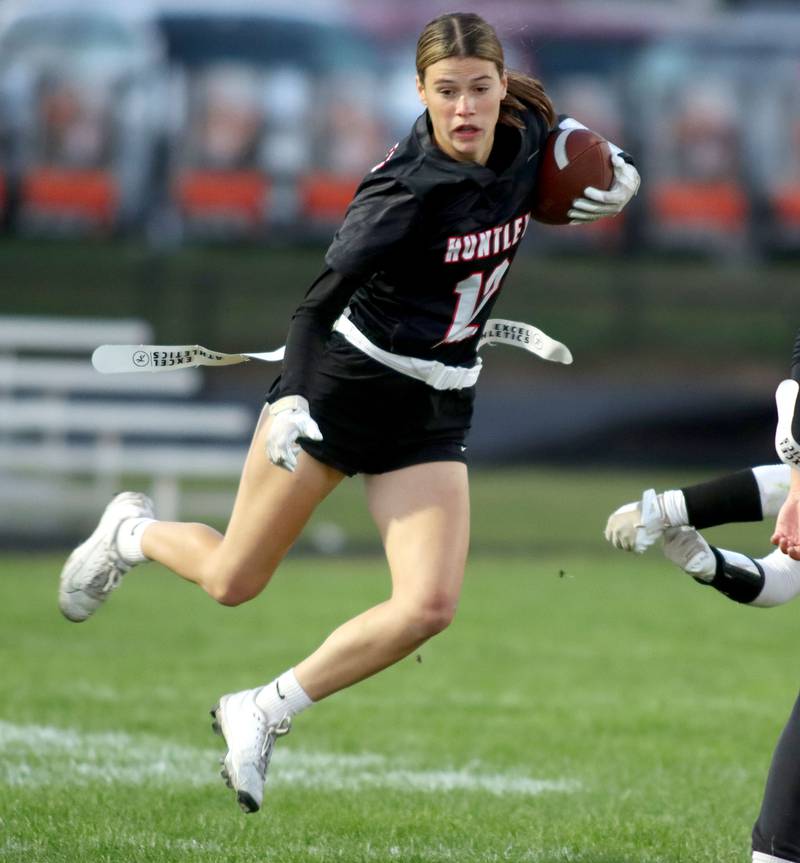 Huntley’s Aubrina Adamik prances for a gain against Antioch in IHSA Regional varsity flag football action at Crystal Lake Central High School in Crystal Lake on Wednesday, Oct. 8, 2025.