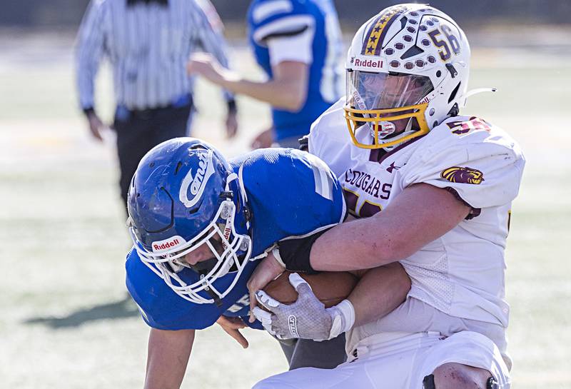 Newman’s Brady Grennan works for yards against ROWVA’s Gage Aldred Saturday, Oct. 28, 2023 in the Class 1A playoffs in Sterling.