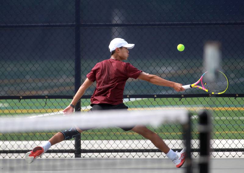 Jacob Kim of Prairie Ridge reaches for the ball during the first round of the 1A boys state tennis meet on Thursday, May 29. 2025 at Buffalo Grove High School.