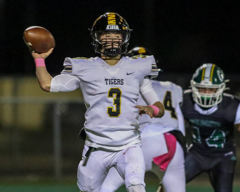 Joliet West's Juan Rico (3) passes to the flat during football game between Joliet West at Plainfield Central.   Oct 20, 2023.