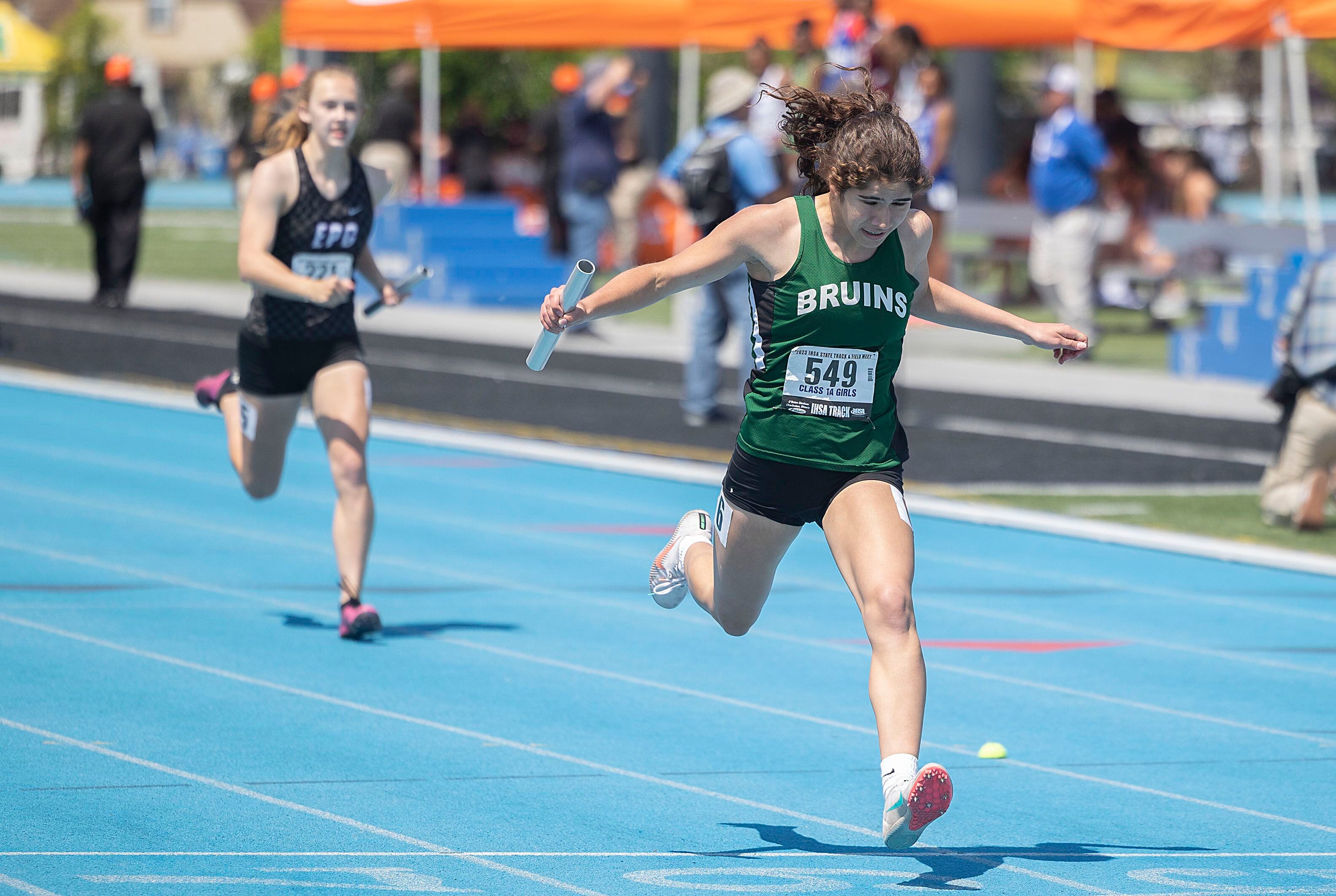 St. Bede’s Lily Bosnich crosses the finish line in the 4x200 race Saturday, May 20, 2023 during the IHSA state track and field finals at Eastern Illinois University in Charleston.