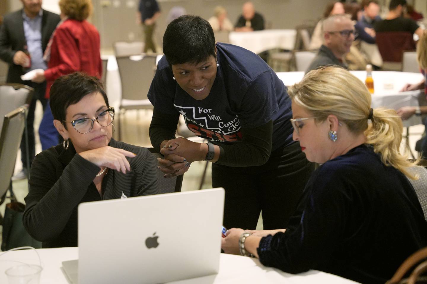 Deputy Majority Leader State Representative Natalie Manley, from left, Michelle Stiff, and Erin Gallagher are seen at the Democratic watch party at IBEW Local 176 hall on Tuesday Nov. 5, 2024 in Joliet, Ill.