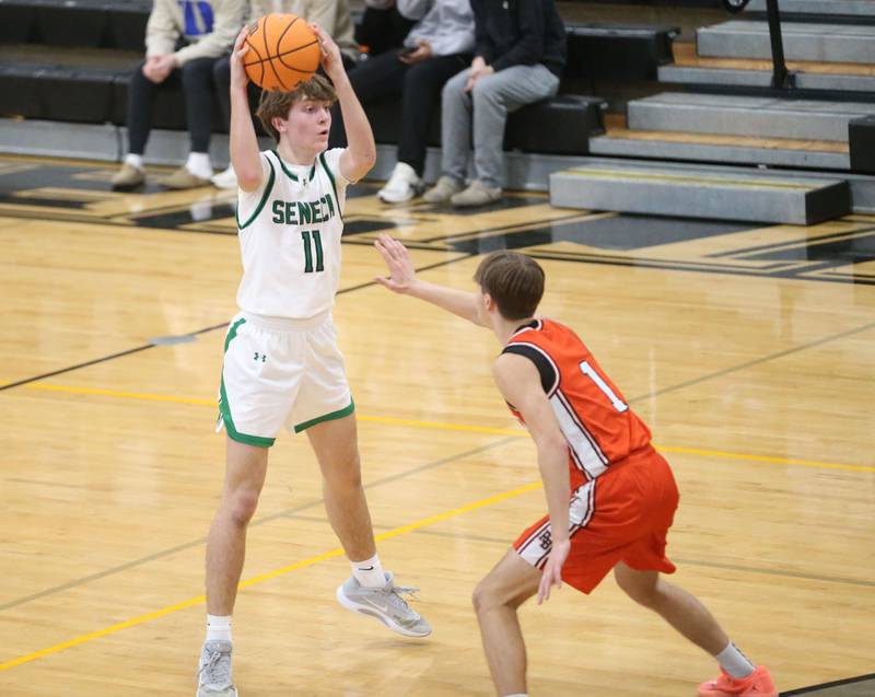 Seneca's Miles LeRoy looks to pss the ball around Roanoke-Benson's Evan Reifsteck during the Tri-County Conference Tournament on Tuesday, Jan. 27, 2026 at Putnam County High Schooo.