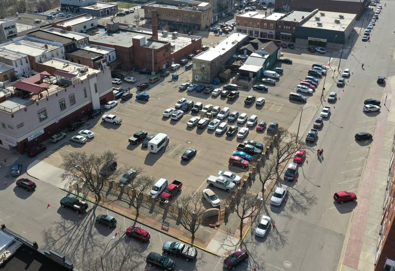 A long line of vehicles wait for carryout meals during the 24th annual spaghetti dinner on Monday, March 27, 2023 at Uptown.