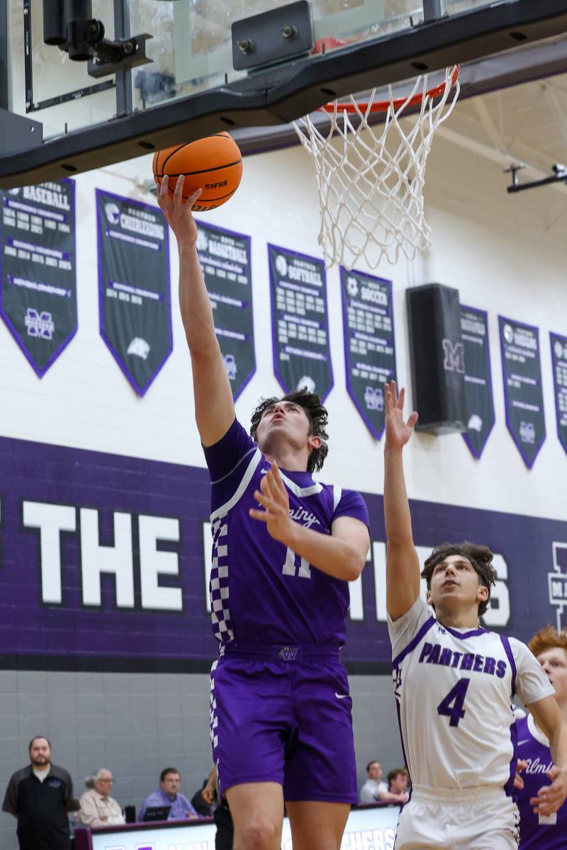 Wilmington's Ryan Kettman hits a layup past Manteno's Cade Bechard during Wilmington's 60-35 victory over Manteno on Tuesday, Feb. 17, 2026.