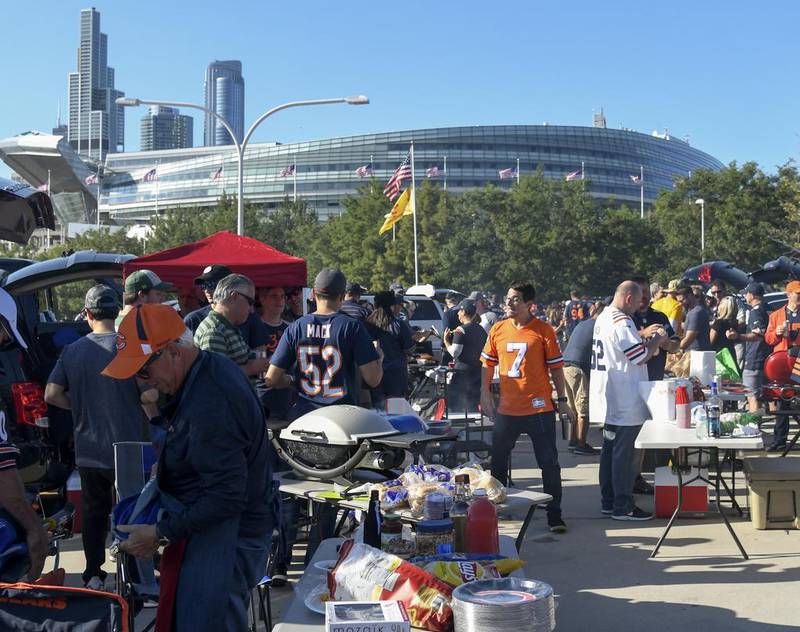 Fans tailgate outside Soldier Field before a game on Sept. 5. The Bears announced Friday that season tickets will not be available in 2020 due to the pandemic. Single game tickets, if fans are allowed in the stadium, will be sold exclusively to season ticket holders.