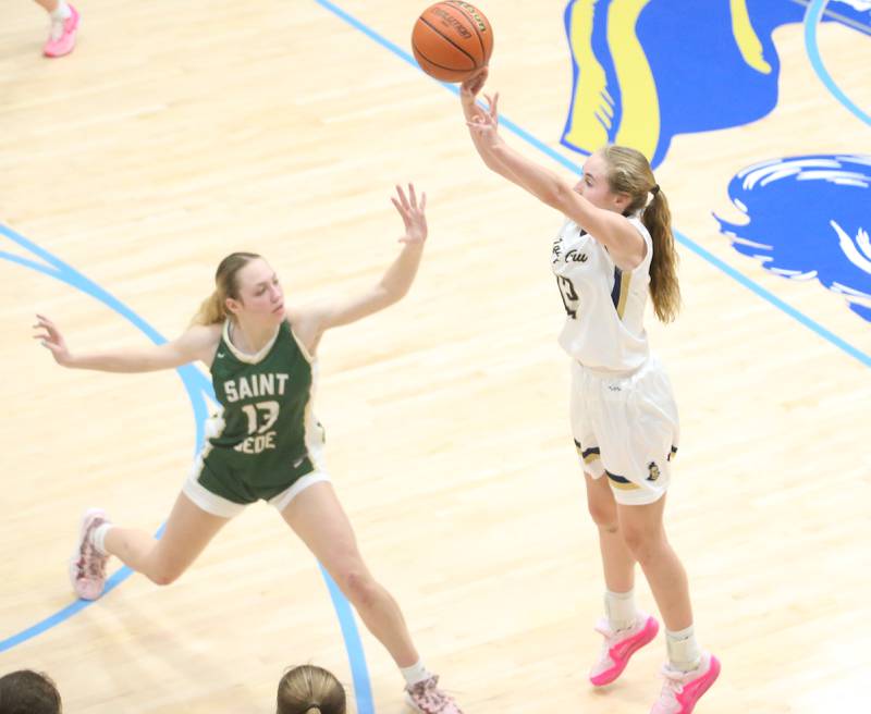 Marquette's Lilly Craig shoots a 3-pointer over St. Bede's Ashlyn Ehm on Monday, Nov. 27, 2023, in Bader Gym at Marquette High School.