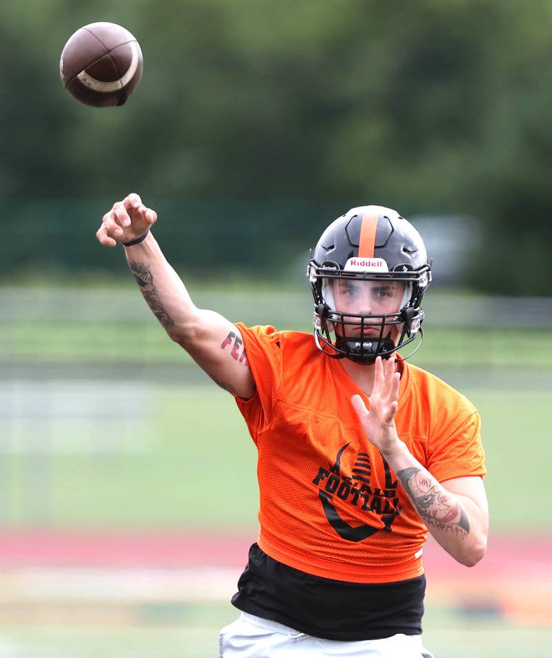 DeKalb quarterback Adrien McVicar throws a pass Monday, Aug. 8, 2022, at the school during their first practice ahead of the upcoming season.