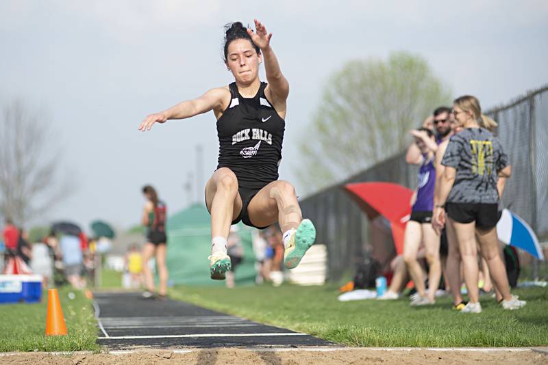 Rock Falls' Carli Kobbeman lands her long jump at the 2A track sectionals in Geneseo on Wednesday, May 11, 2022.