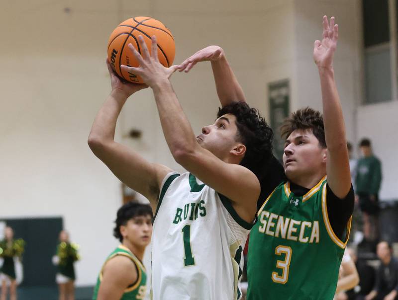 St. Bede's Jose Delatorre eyes the hoop as Seneca's James Zydron defends on Tuesday, Dec. 16, 2025 at St. Bede Academy.