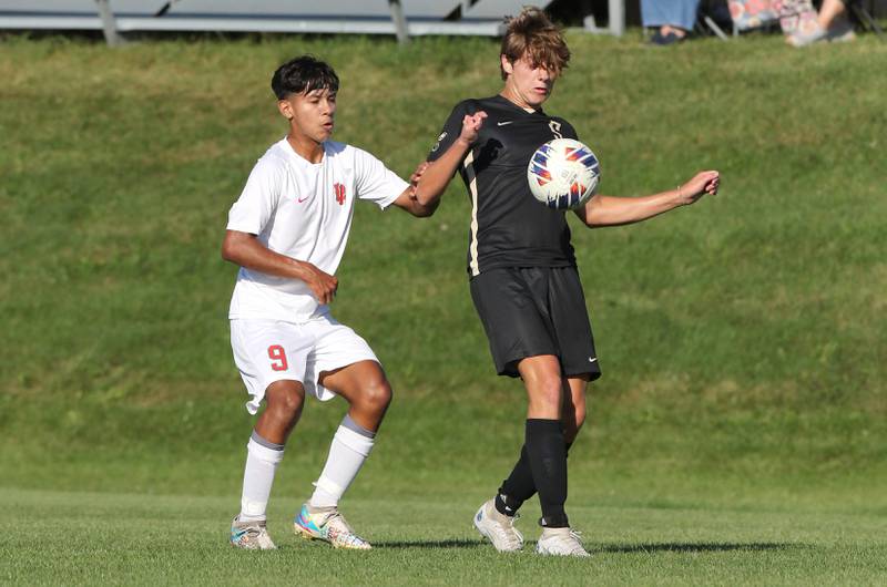 Sycamore's Will Donahoe controls the ball in front of La Salle-Peru's Emir Morales during their game Wednesday, Sept. 7, 2022, at Sycamore High School.